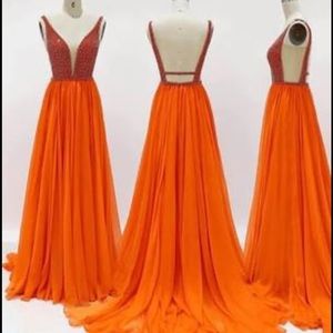 Couture Orange Jovani size 8